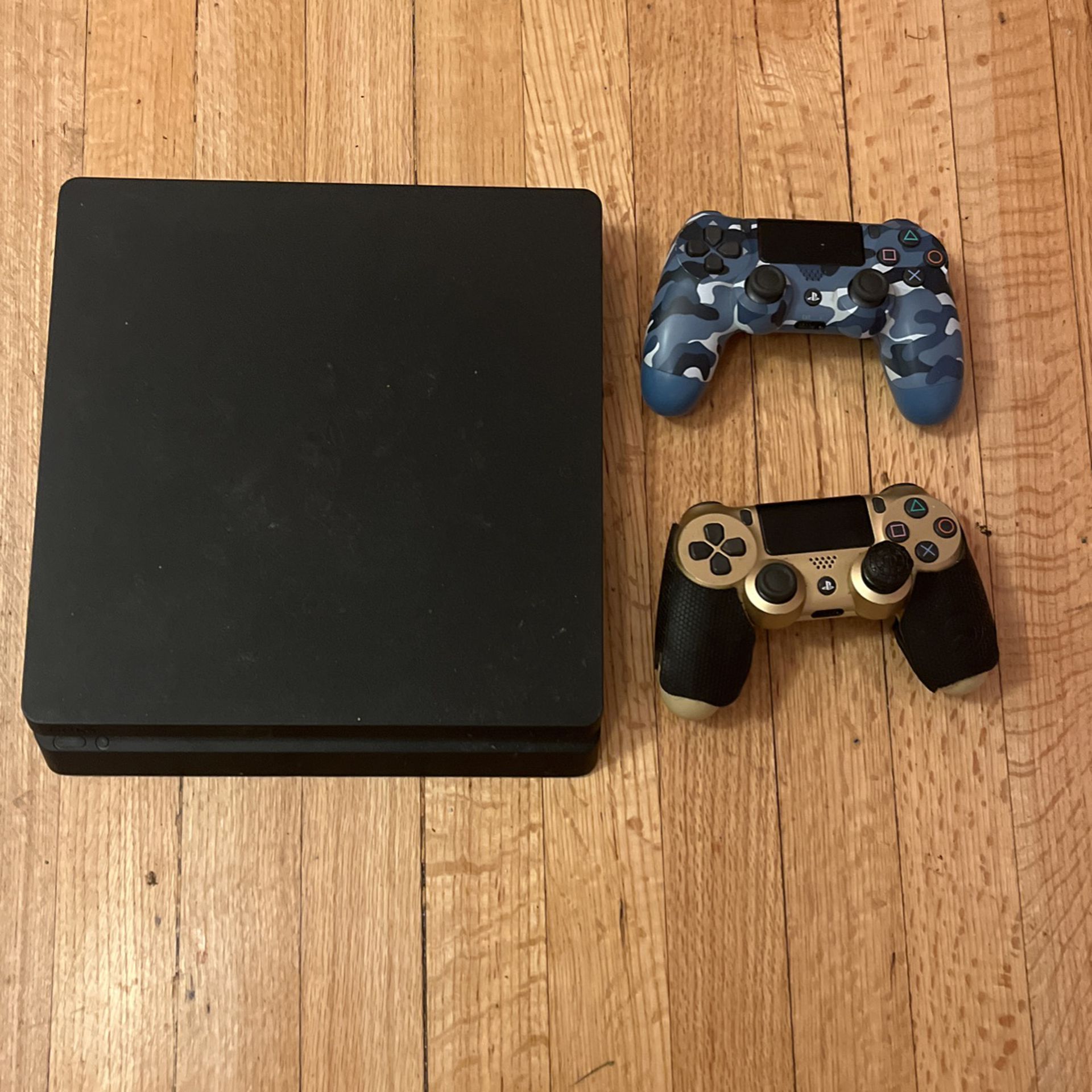 PS4 WITH CONTROLLERS N ALL CORDS