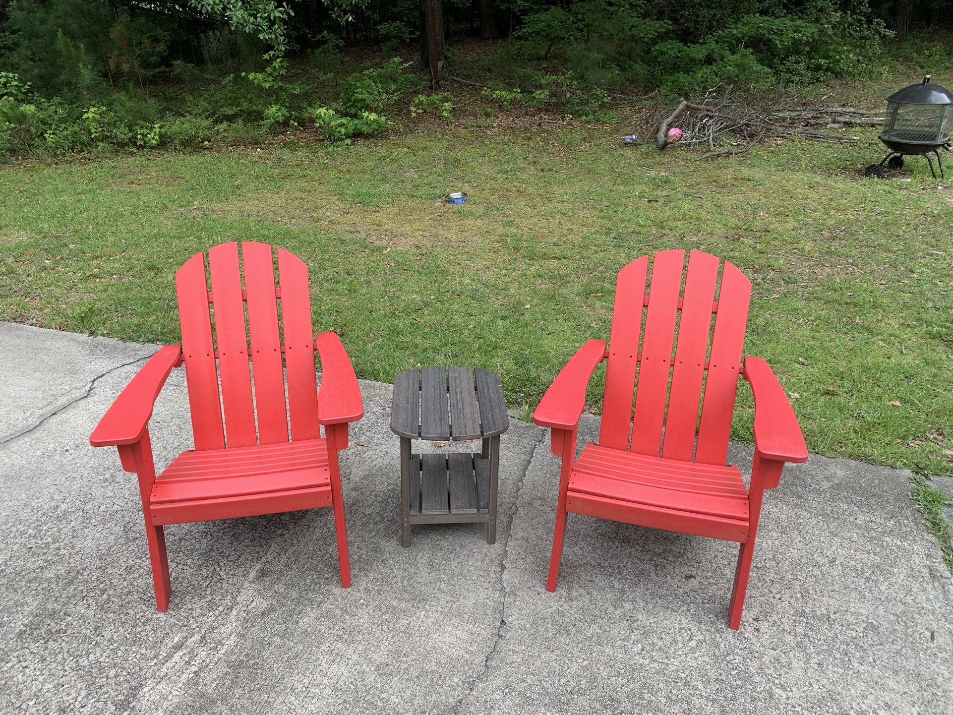 Two Poly Adirondack Chairs With Small Table