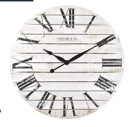 round clock is crafted of wood with a distressed white coloring, black Roman numerals decor $59 First Come First ServeD