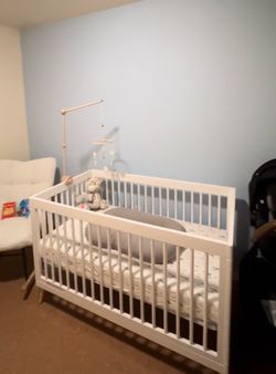 White crib with mattress