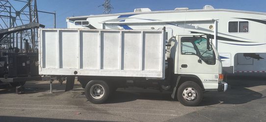 Dump Truck and wood chipper