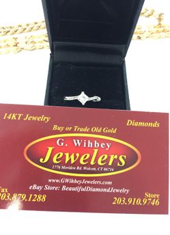1/2 ct pricess diamond set in 14 Kt white gold
