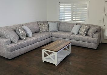 Large modern sectional with 3 farmhouse-style tables