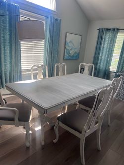 Dining room table and 2 arm chair 4 reg chairs