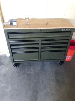 Husky army green 9 drawer toolbox with power strip built in