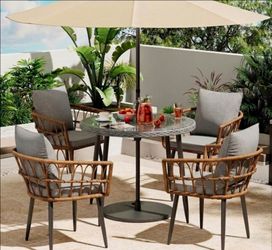 5 pieces outdoor dining set. 4 chairs with cushions and round table. Brand new in box