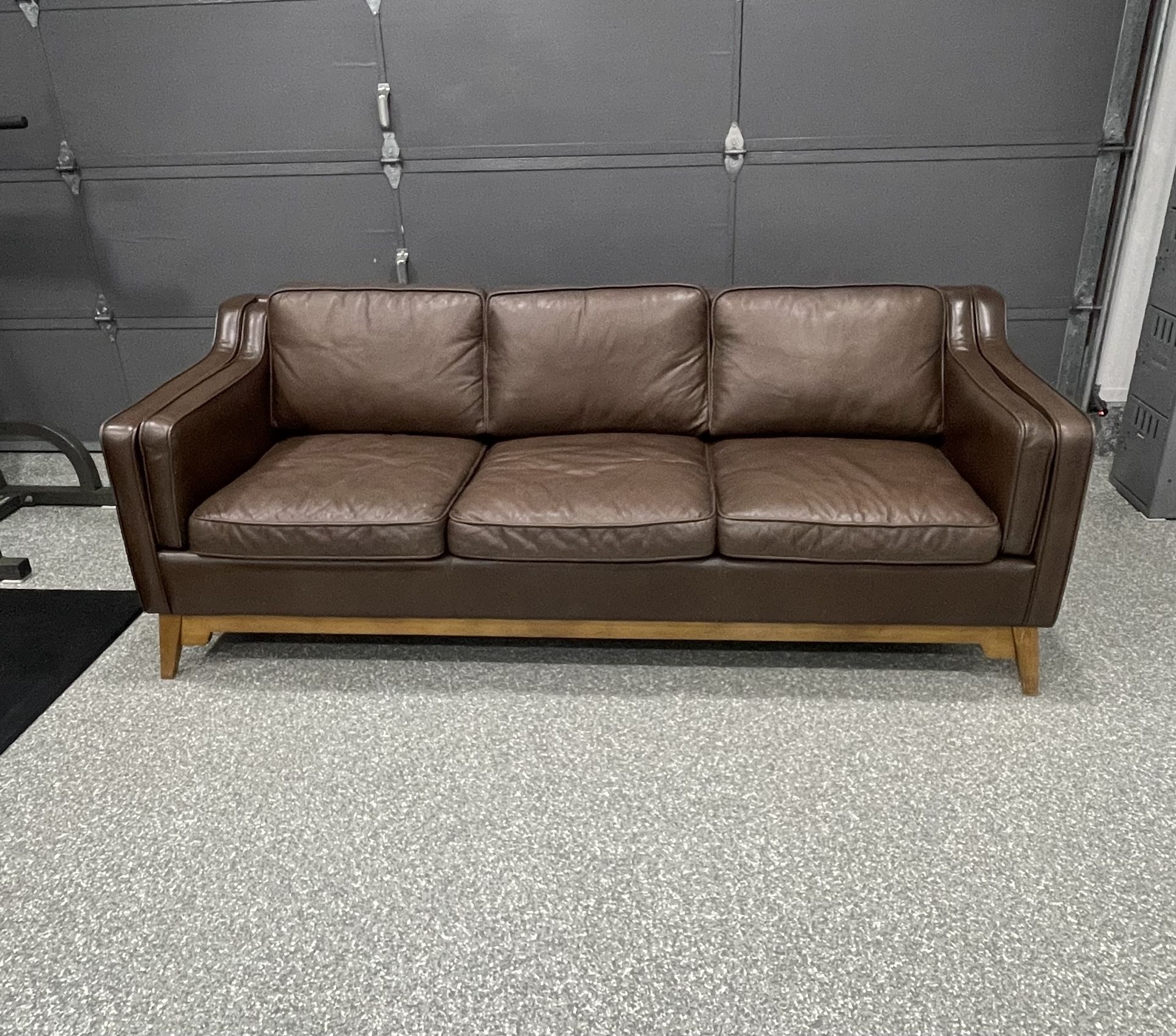 Article genuine leather couch 86" X 34" X 32"). Cleaned and Leather Conditioned.