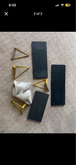 Floating black and gold shelf