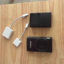 Canon IXY650 Camera With Wall Charger, SD Card, SD Card Adapter And Apple Converter