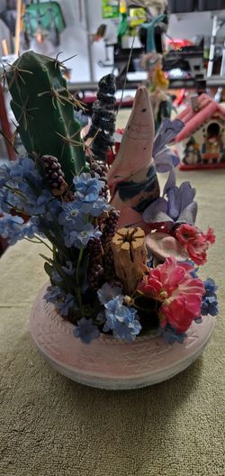 Flower pot with figurine