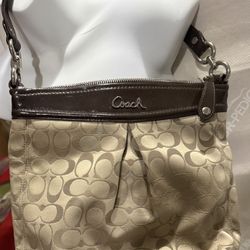 Nice women’s purse brand Is Coach only $45 Inches 