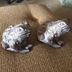 2 cement frog paper weights done in gold and green. 5" tall , 4" wide.