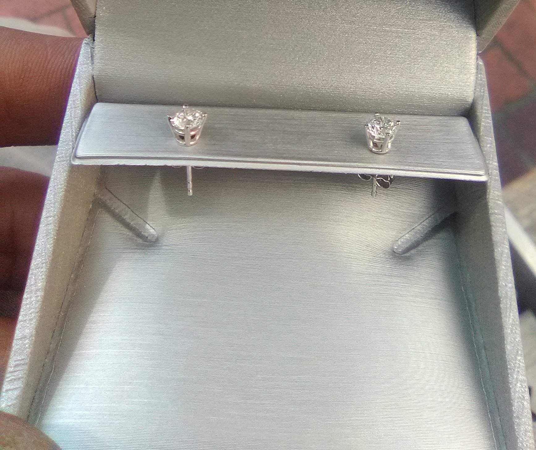 Half a carrot white gold diamond 💎 earrings for 600.00
