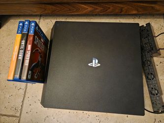 Sony PlayStation 4 Pro Console with 4 Games