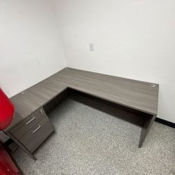 laminate L-shaped office desk with a drawer pedestal