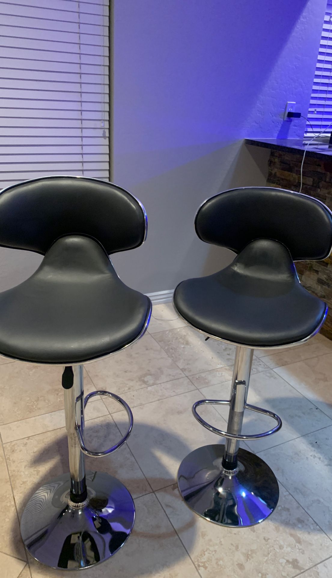 Super cool modern like new bar stools that swivel and go up and down to