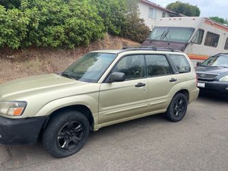 2004 Subaru Forester and 2004 Lexus Lx330