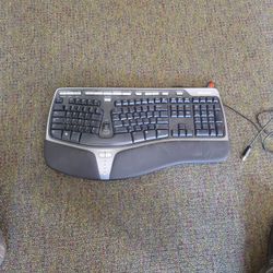 Microsoft Ergo Keyboard.  Works Fine