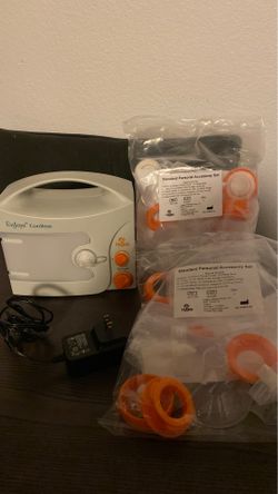 Hygela Breast pump with two unopened accessory set/Pompa para sacar leche