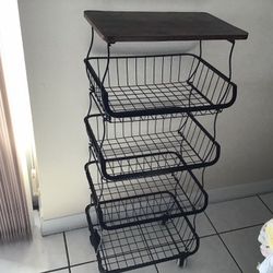 Metal shelf with a wooden top, suitable for holding fruits, root vegetables, or vegetables. It features four storage spaces and measures 37 inches in 