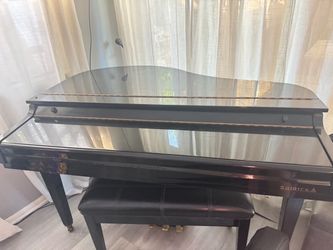 Samick Black Baby Grand Piano With Bench - $1,250