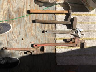 Assorted hammers 26 inch Crest wrench 26 inch pipe