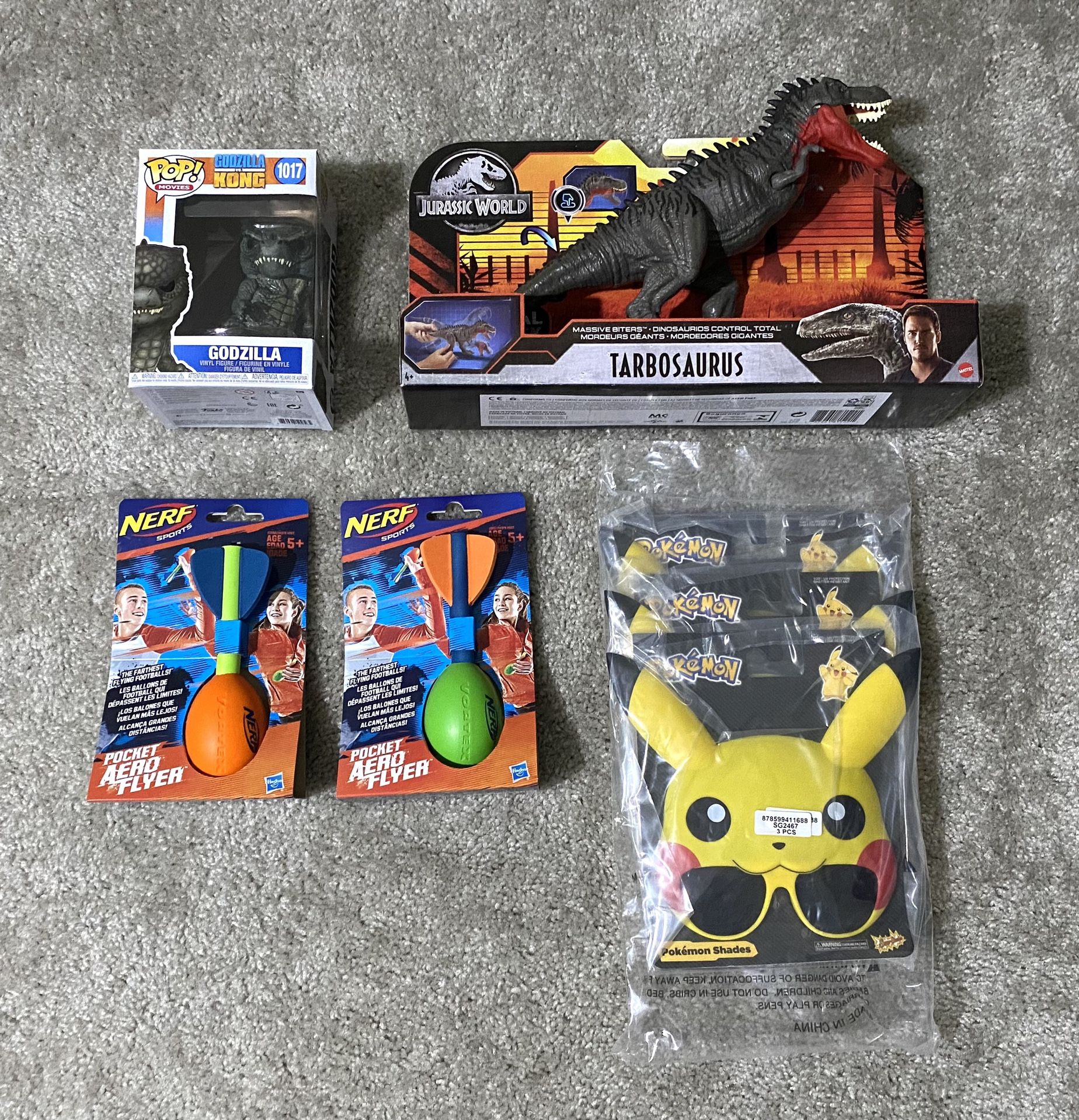 Assorted Toys/Collectibles - Funko Pop Godzilla, Jurassic World Tarbosaurus, Two Nerf Vortex Pocket Aero Flyers, Three Pikachu Shades