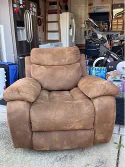 Brown Rocker Recliner it’s 3 feet tall bye 3 feet front to back and 3”7inchs wide