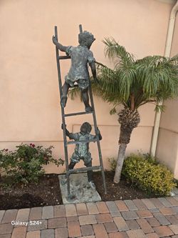 Bronze “boys in the ladder” sculpture