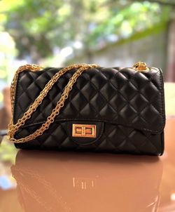 Black quilted faux leather crossbody bag with gold hardware