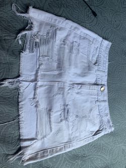 Ripped white denim skirt