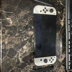 Nintendo Switch OLED, Games, Extra Joy cons, Joy Con Grip,  And Dock.