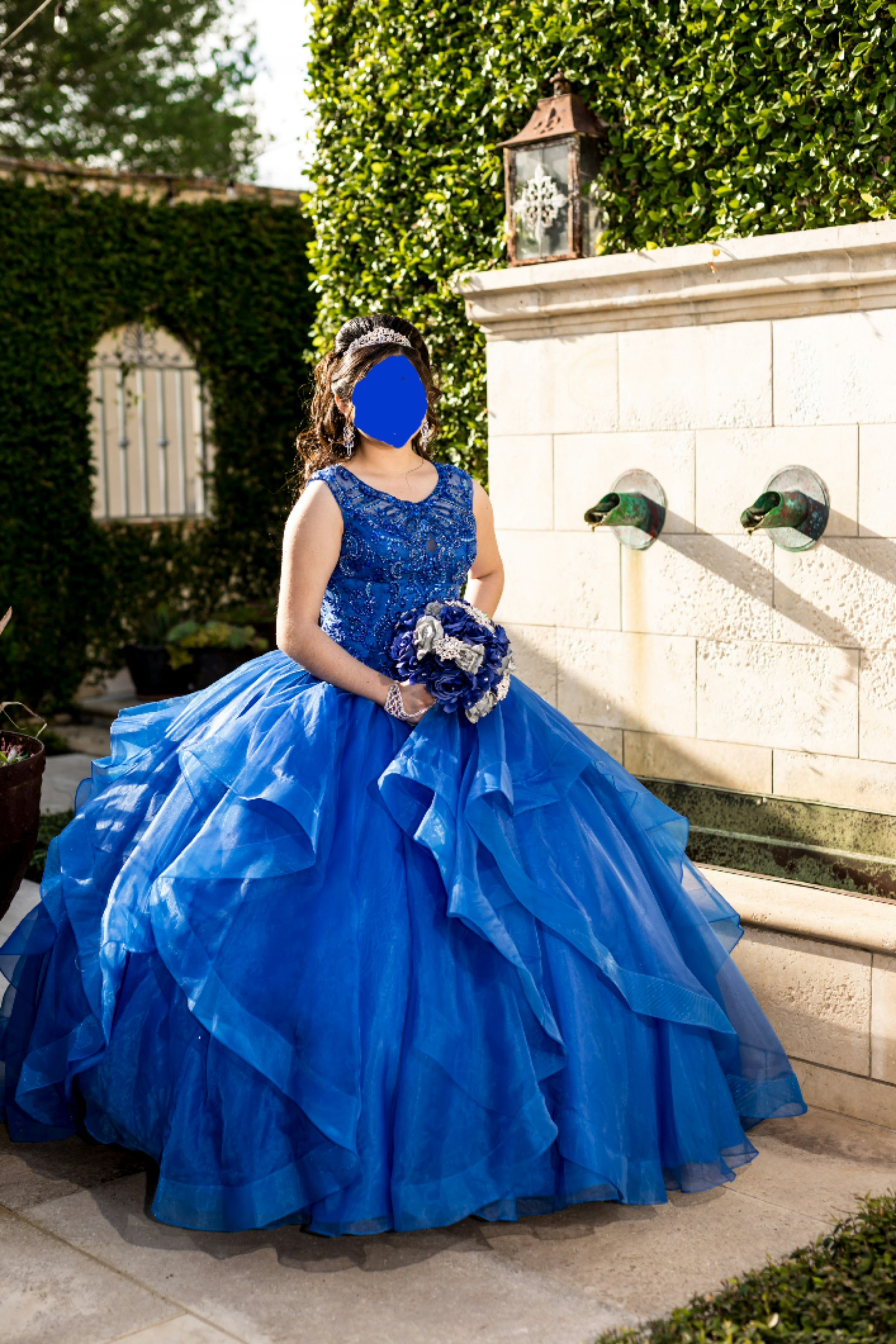 Royal blue quinceanera dress with accessories.