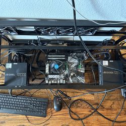 Open rig frame, EVGA SuperNOVA 750 G+ Power Supply, and Intel Celeron G4930 CPU