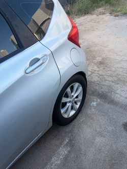 Silver Nissan Hatchback