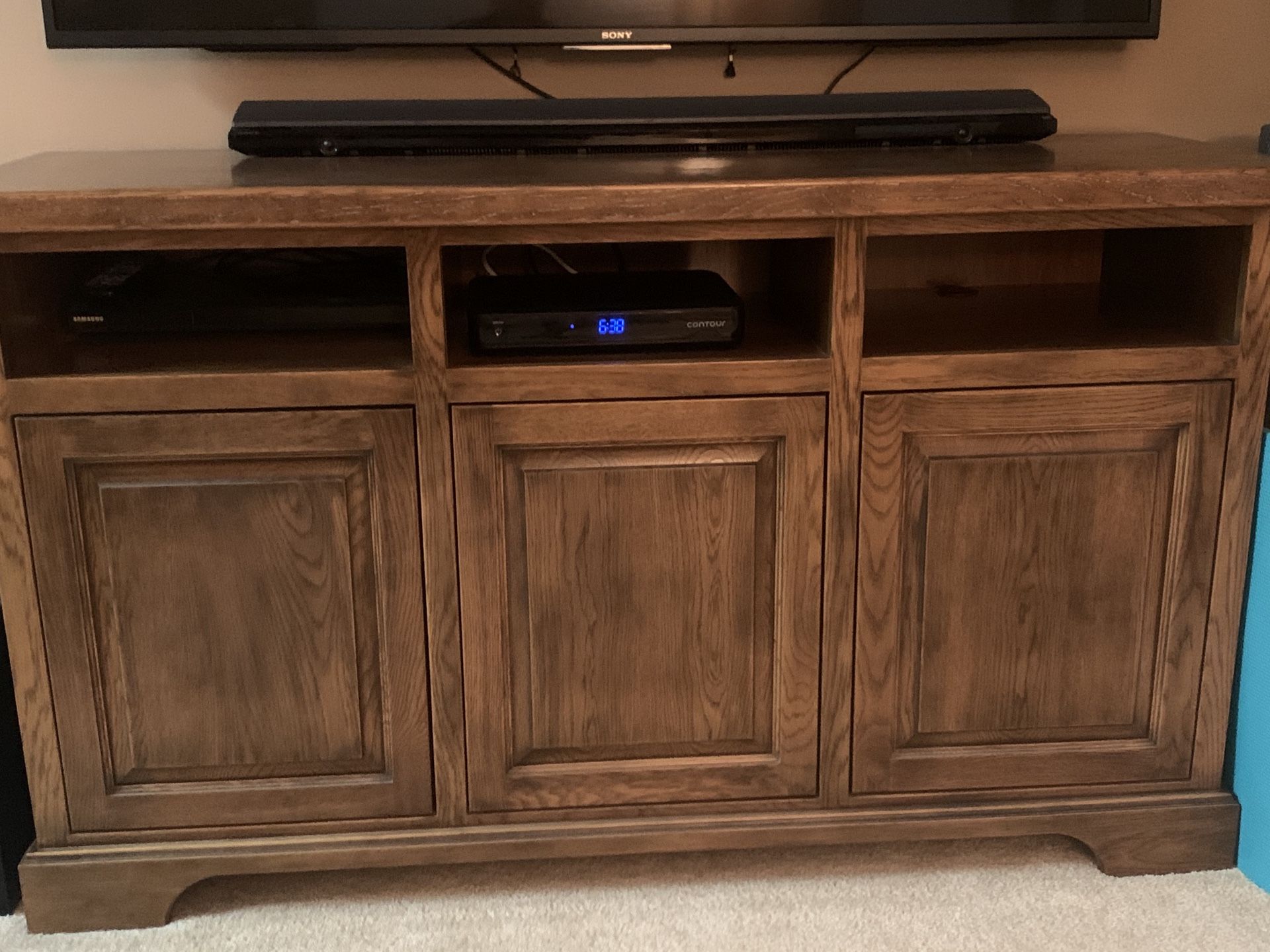 Custom made solid Red Oak 61x19 entertainment center for under wall mounted TV. Made by local cabinet shop. Must come get.