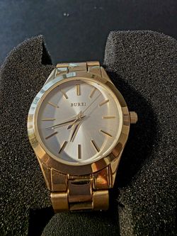 BRAND NEW Ladies Burei Gold Watch with 30m Pearl Face. Never Worn. Very Easy to Read. Keeps Perfect Time. Crystal Quartz.