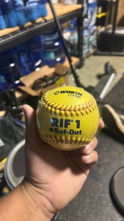 New in wrapper and used softballs