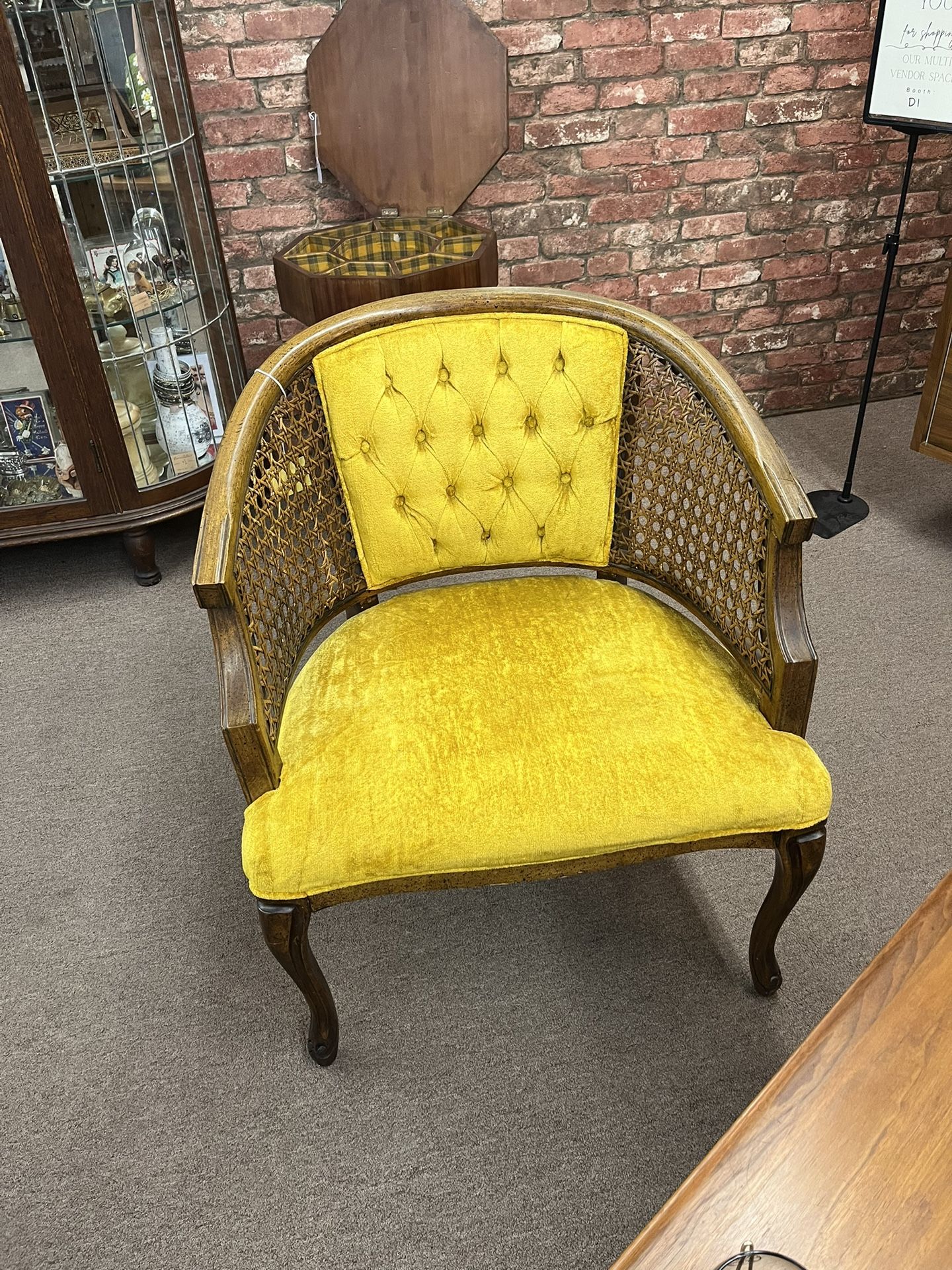 Cane and Gold Tufted arm chair