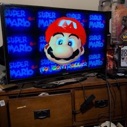 N64 System With Mario Kart And Super Mario World 