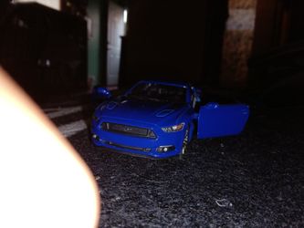 Blue Toy Car Version Of The Ford Mustang