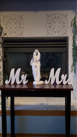 Mr. & Mrs. wood and glass statue
