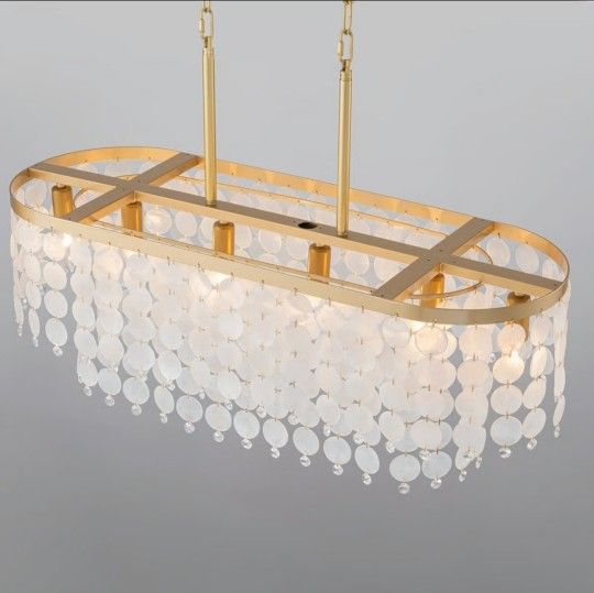 6-light tiered shell chandelier with a gold finish, oval frame shape