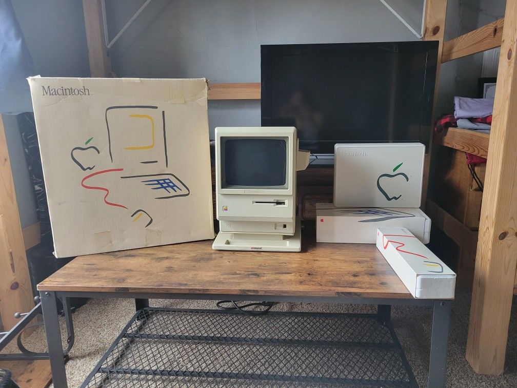 Macintosh 128k in box, 1MB upgrade, keyboard in box, mouse in box, external floppy in box, starter kit