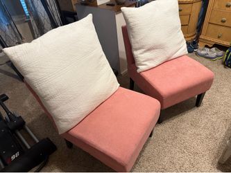 Pink chairs with white pillows