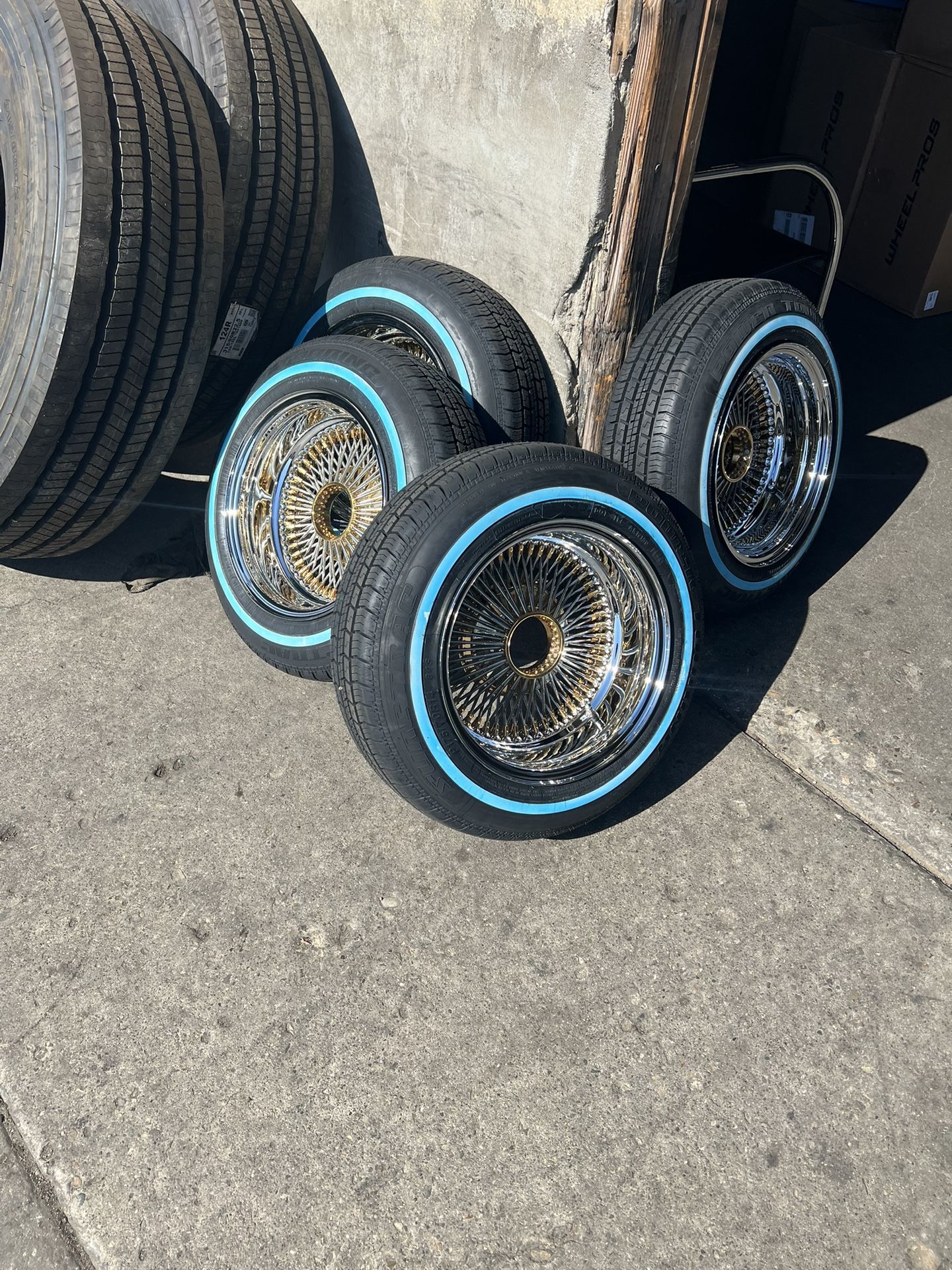 14x7 Daytons Gold on Chrome with new Tires
