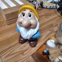 The Bashful From Snow White Walt Disney Productions 6in Runner Figurine is a collectible figurine from Disney's franchise. Standing at 6 inches tall, 