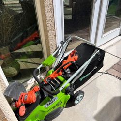 Used GreenWorks Corded Lawn Mower And Black And Decker Corded Weed Wackier. 