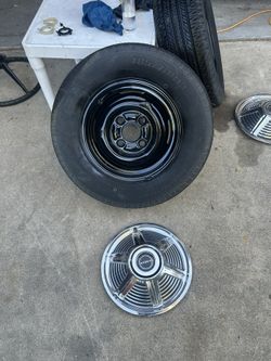Pair FORD Mustang OEM 4 Lug Rims And Tires .