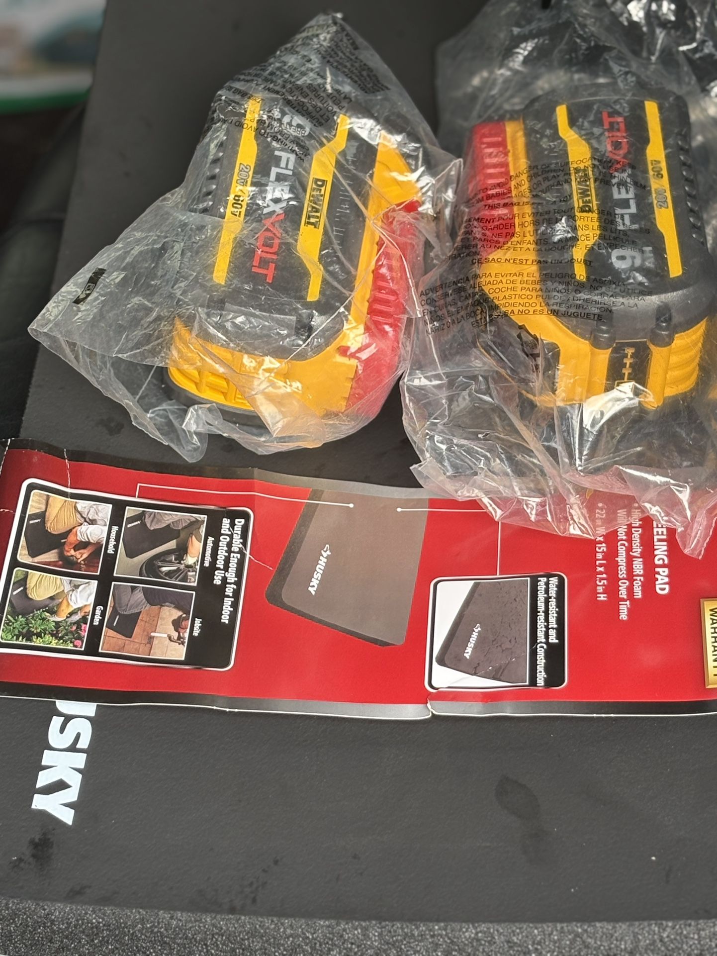 2 Dewalt 9AH Batteries And A Husky Kneeling Pad